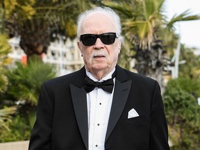 U.S. director John Carpenter (C) strolls on the Promenade de la Croisette during the 72nd edition of the Cannes Film Festival in Cannes, southern France, on May 15, 2019.
