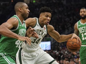 Milwaukee Bucks' Giannis Antetokounmpo tries to drive past Boston Celtics' Al Horford during the first half of Game 5 of a second round NBA basketball playoff series Wednesday, May 8, 2019, in Milwaukee.