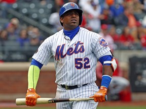 In this Sunday, April 1, 2018 file photo, New York Mets Yoenis Cespedes (52) holds his broken bat against the St. Louis Cardinals in New York. (AP Photo/Kathy Willens, File)