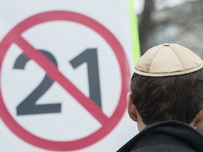 A man wears a yarmulke during a demonstration opposing the Quebec government's newly tabled Bill 21 in Montreal, Sunday, April 14, 2019.
