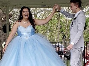 Addi Rust (L) in the prom dress that Parker Smith made for her. (TWITTER)