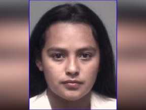 In this undated Grand Prairie, Texas, Police Department booking photo is Dalia Jimenez, a suburban Dallas woman who has been charged after police say she doused her five-year-old stepdaughter's face with rubbing alcohol and set it on fire.