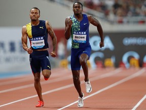 Canadians Andre de Grasse (L) and Aaron Brown  compete in the men's 200-metres during the Diamond League Track and Field meet in Shanghai, China, Saturday, May 18, 2019.