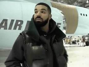 Drake standing in front of his new private plane. (instagram.com/champagnepapi)