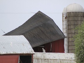 A damaged barn is at the corner of Barryville and Cloverdale roads Southwest of Nashville, Mich., Monday, May 20, 2019. Authorities say severe thunderstorms that moved across Michigan spawned a weak tornado in western Michigan that damaged barns and knocked down trees.
