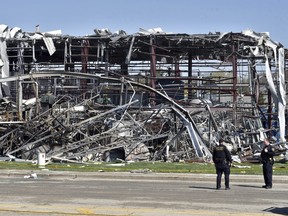 Emergency personnel work at the scene of an explosion at AB Specialty Silicones on Sunset Ave. and Northwestern Ave. on the border between Gurnee, Ill., and Waukegan on Saturday, May 4, 2019. (John Starks/Daily Herald via AP)
