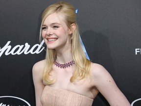 Elle Fanning poses for photographers upon arrival at the Chopard Trophee event at the 72nd international film festival, Cannes, southern France, Monday, May 20, 2019.