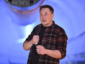 In this Tuesday, Dec. 18, 2018 file photo, Elon Musk, co-founder and chief executive officer of Tesla Inc., speaks during an unveiling event for the Boring Co. Musk will have to go to trial to defend himself for mocking a British diver as a pedophile in a verbal sparring match that unfolded last summer after the underwater rescue of youth soccer players trapped in a Thailand cave. A federal court judge in Los Angeles set an Oct. 22, 2019, trial date in a Friday, May 10, court filing that rejected Musk's attempt to dismiss a defamation lawsuit filed by British diver Vernon Unsworth.