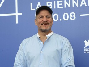In this Sept. 4, 2017, file photo, actor Woody Harrelson poses for photographers at the photo call for the film "Three Billboards Outside Ebbing, Missouri" during the 74th edition of the Venice Film Festival in Venice, Italy.