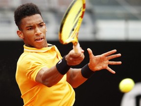Felix Auger-Aliassime hits a forehand during his first round match againts Borna Coric during at the International BNL d'Italia at Foro Italico in Rome on May 13, 2019.