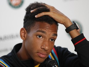 Canada's Felix Auger-Aliassime answers question during a press conference after withdrawing from the French Open, at the Roland Garros stadium in Paris, Sunday, May 26, 2019. (AP Photo/Pavel Golovkin)