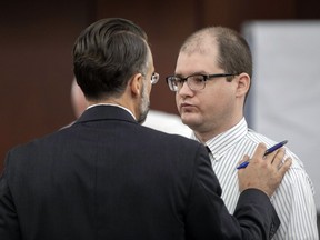 Defence attorney Casey Secor talks with Tim Jones during trial in Lexington, S.C.