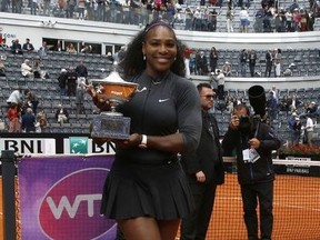In this Sunday, May 15, 2016 file photo, Serena Williams poses with the trophy after beating Madison Keys 7-6, 6-3, in the final match of the Italian Open tennis tournament, in Rome. Serena Williams is set to return from injury at the upcoming Italian Open. Tournament director Sergio Palmieri tells The Associated Press that he spoke with Williams' representative "four-five days ago" and that "she has already reserved her rooms and should be here a few days early" for the May 13-19 event.