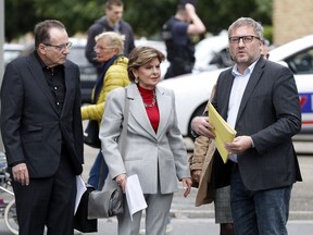 American lawyer Gloria Allred, centre, and French lawyer, Jean Marc Describes, right, arrive to give a press conference, in Paris, Tuesday, May 28, 2019.