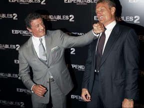 Actors Sylvester Stallone and Dolph Lundgren pose on August 9, 2012 in Paris, during the photocall of "The Expandables 2." (KENZO TRIBOUILLARD/AFP/GettyImages)
