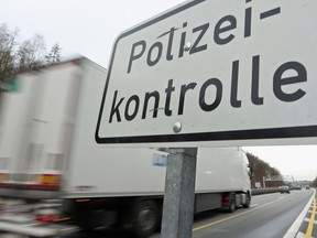 The sign 'Polizeikontrolle' ('Police Check Point') is seen on the A3 highway near the border to Austria on a section of the Autobahn on Jan. 28, 2016 near Passau, Germany. (Johannes Simon/Getty Images)