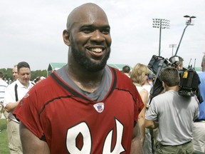 In this July 27, 2007, file photo, Buccaneers defensive end Greg Spires walks off the practice field after the morning session at training camp in Lake Buena Vista, Fla.