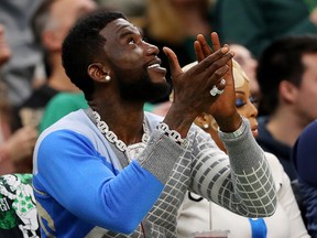 Rapper Gucci Mane watches Game 3 of the Eastern Conference Semifinals of the 2019 NBA Playoffs between the Boston Celtics and the Milwaukee Bucks at TD Garden on May 03, 2019 in Boston, Massachusetts.