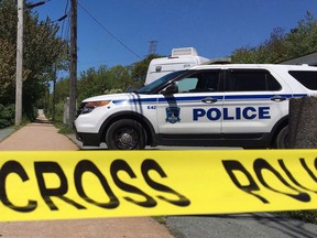 Forensic officers with Halifax Regional Police search for evidence on a Dartmouth footpath, Wednesday, June 7, 2017. Police in Halifax have told the city's civilian oversight body that they won't be issuing a formal apology to the African Nova Scotian community over street checks.