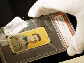 A rare baseball card of Honus Wagner of the Pittsburgh Pirates, considered to be the best all around player in baseball history, is displayed at a preview of a sports memorabilia sale at Sotheby's in New York. (STAN HONDA/AFP/Getty Images)