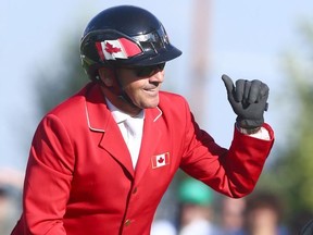 Eric Lamaze celebrates his clear second round on horse Coco Bongo in the Nations' Cup during the Masters at Spruce Meadows in Calgary on Sept. 8, 2018. The Nations' Cup was won by Germany and Canada finished second.