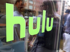 This June 27, 2015, file photo, shows the Hulu logo on a window at the Milk Studios space in New York.