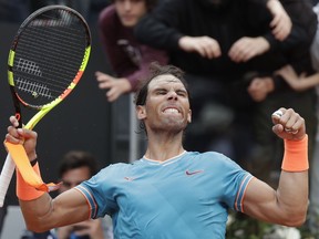 Rafael Nadal of Spain celebrates after defeating Stefanos Tsitsipas of Greece during a semifinal match at the Italian Open tennis tournament, in Rome, Saturday, May 18, 2019.