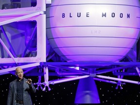 Jeff Bezos speaks in front of a model of Blue Origin's Blue Moon lunar lander, Thursday, May 9, 2019, in Washington.