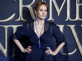 In this file photo taken on Nov. 13, 2018, British author and screenwriter J.K. Rowling poses upon arrival to attend the UK premiere of the film 'Fantastic Beasts: The Crimes of Grindelwald' in London.