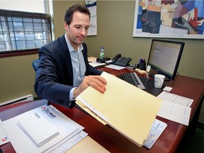 Former Canadian Mathieu Darche does work at his desk at Delmar International Inc. in Montreal on Aug. 29, 2013.