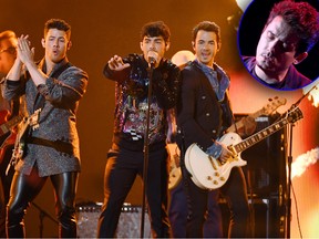 (L-R) Nick Jonas, Joe Jonas and Kevin Jonas of Jonas Brothers perform during the 2019 Billboard Music Awards at MGM Grand Garden Arena on May 1, 2019 in Las Vegas.  Nick Jonas says John Mayer (inset) copied one of their songs but he's not upset about it.