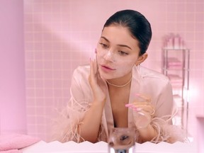 Kylie Jenner washes her face with her Foaming Face Wash in a promotional video of her new skincare line. (YouTube screengrab)