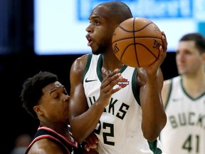 Raptors’ Kyle Lowry gets a face full of elbow from Bucks’ Khris Middleton during Game 2 of their Eastern Conference final on Friday night at Fiserv Forum in Milwaukee. (Getty Images)