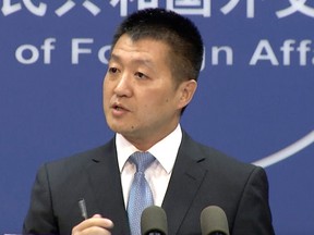 In this July 12, 2016, file photo, Lu Kang, spokesman of the Chinese Ministry of Foreign Affairs, speaks to reporters about the international tribunal's ruling on the South China Sea during a news briefing in Beijing.