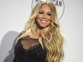 In this Oct. 9, 2018, file photo Mariah Carey poses in the press room at the American Music Awards at the Microsoft Theater in Los Angeles.