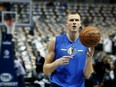 In this April 3, 2019, file photo, Dallas Mavericks forward Kristaps Porzingis practices before an NBA basketball game against the Minnesota Timberwolves in Dallas.