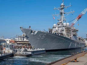 In this file handout photo released by the U.S. Navy on Nov. 27, 2018 the Arleigh Burke-class guided missile destroyer USS John S. McCain prepares to depart from a dry dock at Fleet Activities Yokosuka, Japan.