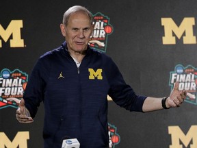 In this March 29, 2018, file photo, Michigan head coach John Beilein answers questions after a practice session for the Final Four NCAA college basketball tournament, in San Antonio.