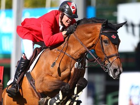 Ian Millar, from Canada, rides Dixson, in the Nations' Cup during the Masters at Spruce Meadows in Calgary on Saturday, Sept. 8, 2018.