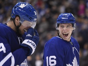 Maple Leafs' Mitch Marner (right) is closing in on 100 points for the season. (THE CANADIAN PRESS FILES)
