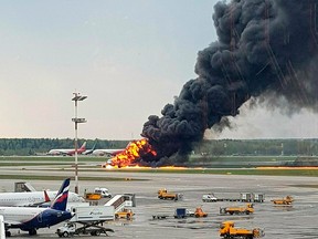In this image provided by Riccardo Dalla Francesca shows smoke rises from a fire on a plane at Moscow's Sheremetyevo airport on Sunday, May 5, 2019.