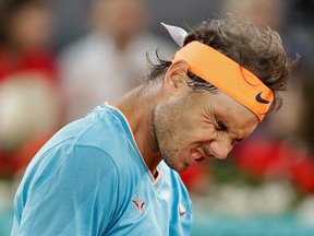 Rafael Nadal of Spain reacts after missing a point against Stefanos Tsitsipas of Greece during the Madrid Open tennis men's semi-final match in Madrid, Spain, Saturday, May 11, 2019.