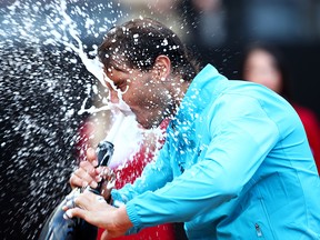 Rafael Nadal of Spain drinks champagne from the bottle after his three set victory against Novak Djokovic of Serbia in the men's final during day eight of the International BNL d'Italia at Foro Italico on May 19, 2019 in Rome, Italy.