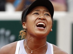 Japan's Naomi Osaka screams after scoring a point against Victoria Azarenka of Belarus during their second round match of the French Open at the Roland Garros stadium in Paris, Thursday, May 30, 2019.