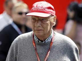 In this July 7, 2018, file photo, former Formula One World Champion Niki Lauda of Austria walks in the paddock before the third free practice at the Silverstone racetrack, Silverstone, England.