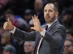 In this Nov. 25, 2017, file photo, Orlando Magic coach Frank Vogel signals from the sideline during the first half of the team's NBA game against the Philadelphia 76ers in Philadelphia.