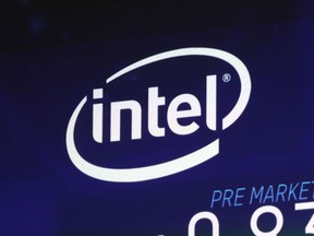 In this Oct. 3, 2018, file photo the Intel logo appears on a screen at the Nasdaq MarketSite, in New York's Times Square.