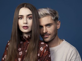 This April 22, 2019 photo shows Zac Efron, right, and Lily Collins posing for a portrait at the Four Seasons Hotel in Los Angeles to promote their film "Extremely Wicked, Shockingly Evil, and Vile."
