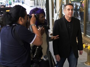 Michael Cohen, President Donald Trump's former personal attorney, is confronted by members of the media as he heads back to his Park Avenue apartment in New York on Saturday, May 4, 2019.