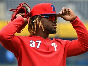 Odubel Herrera of the Phillies adjusts his cap as he prepares for batting practice prior to a game against the Royals at Kauffman Stadium in Kansas City, Mo., on May 11, 2019.